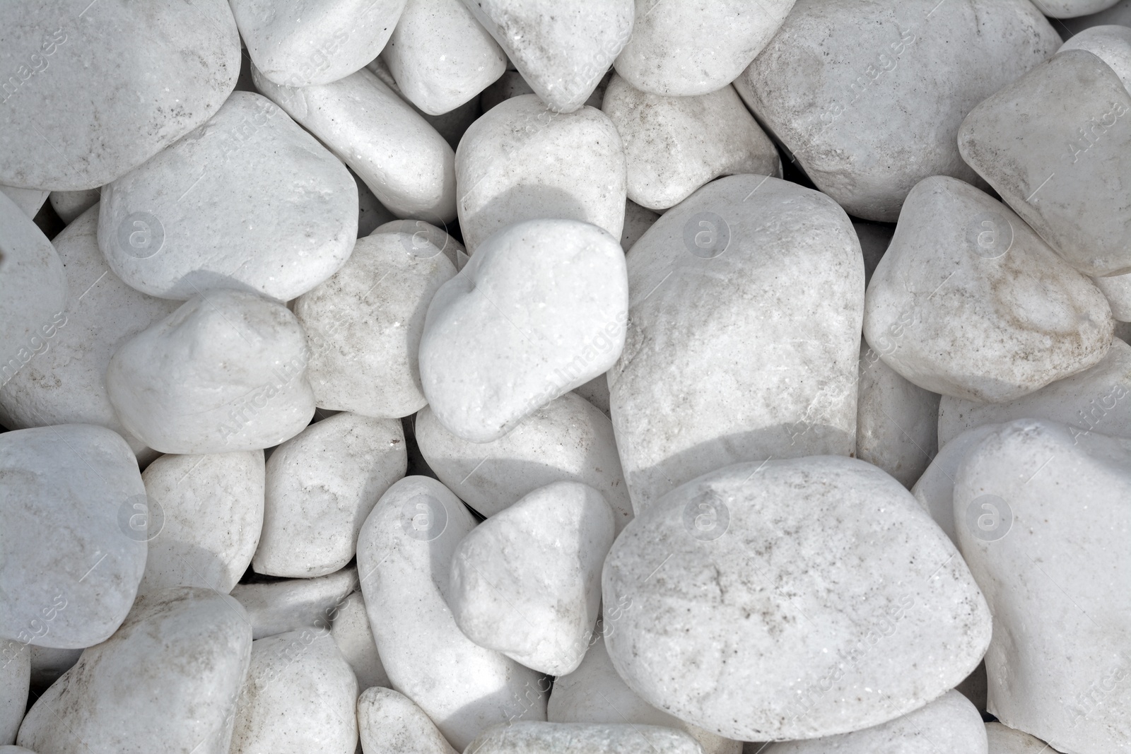 Photo of Pile of white stones as background, top view