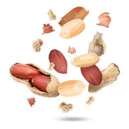 Peanuts and crushed pod in air on white background