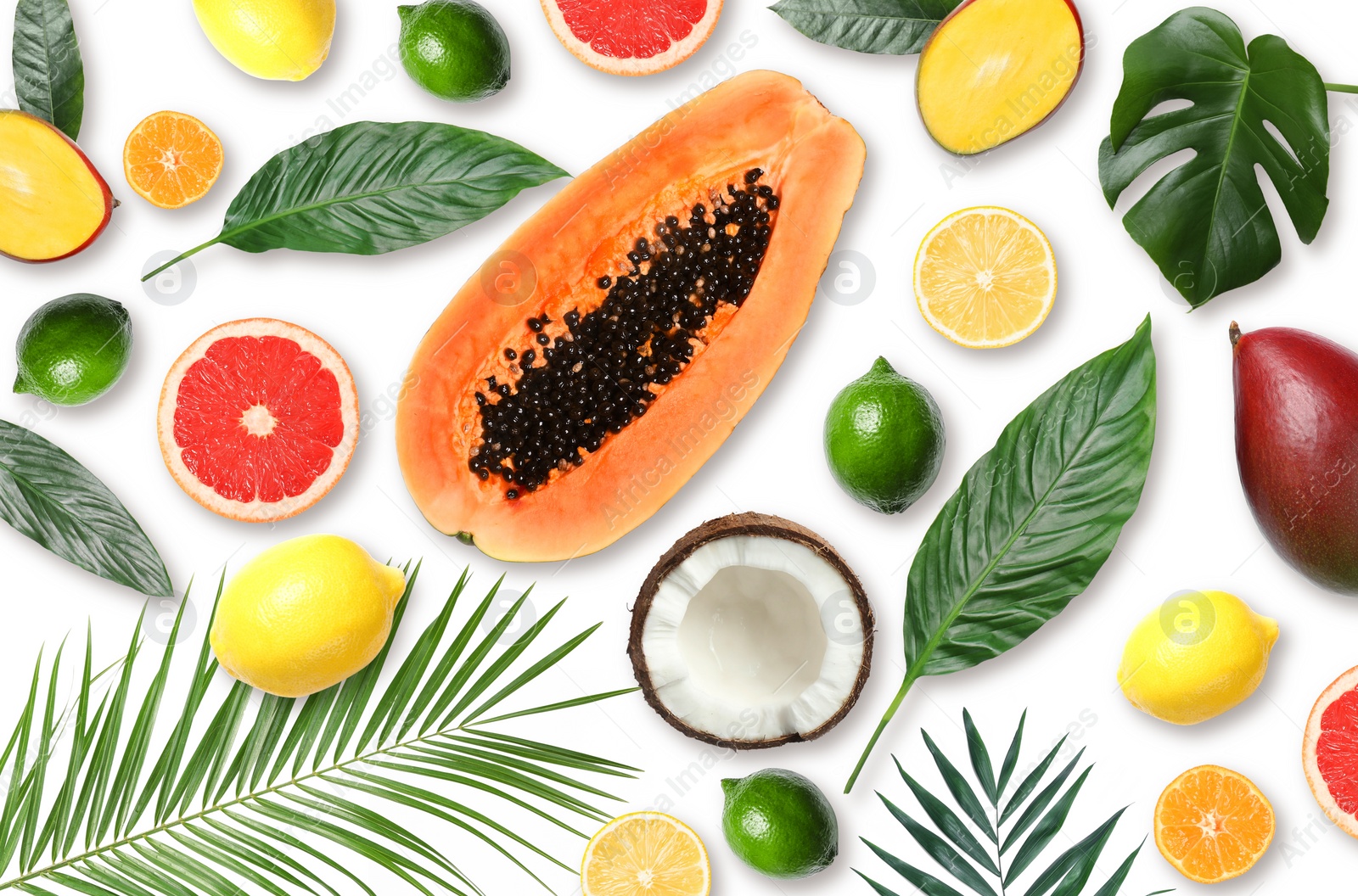 Image of Tropical layout with fresh exotic fruits and green leaves on white background, top view