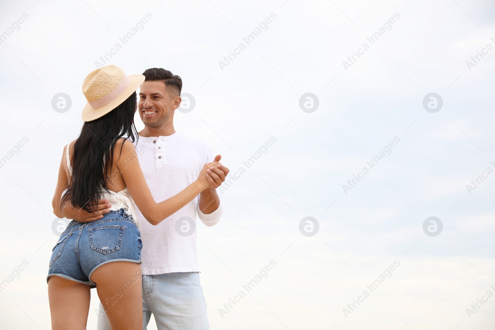 Photo of Lovely couple spending time together outdoors. Space for text