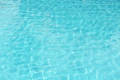 Photo of Clear refreshing water in swimming pool, closeup