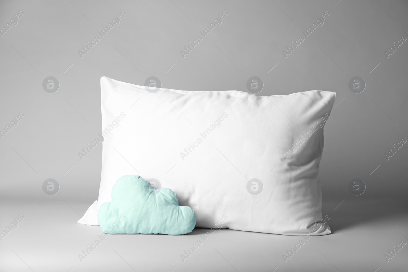 Photo of Blank and decorative pillows on light background