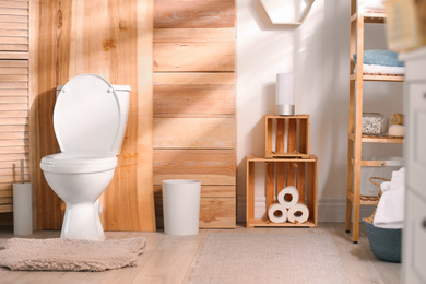 Modern toilet bowl in stylish bathroom interior