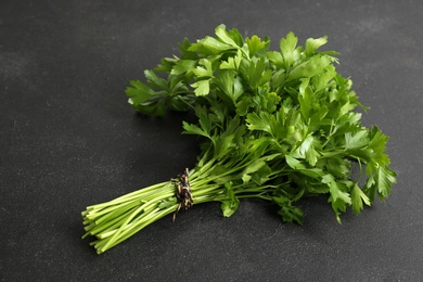 Bunch of fresh green parsley on black background