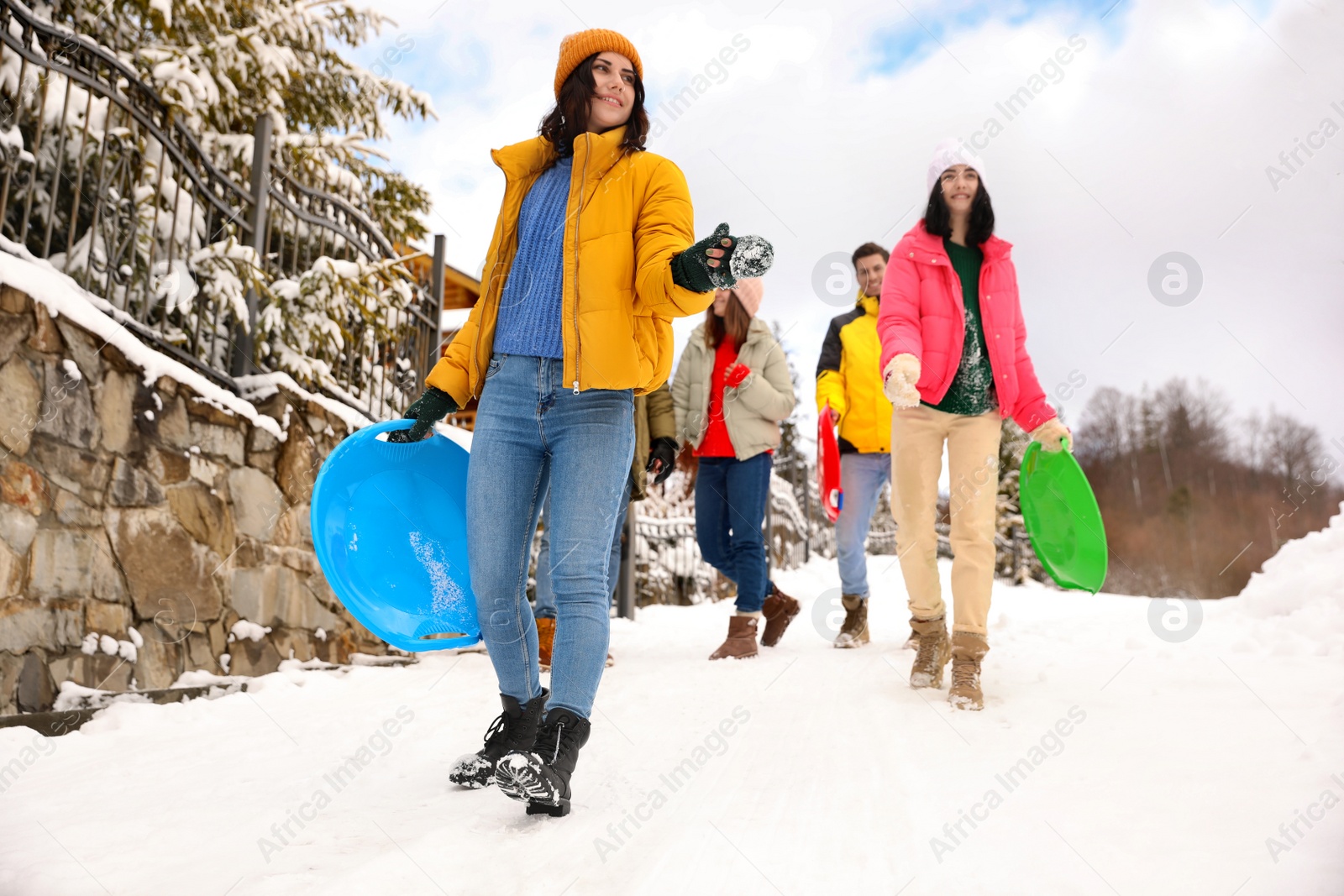 Photo of Group of friends outdoors on snowy day. Winter vacation