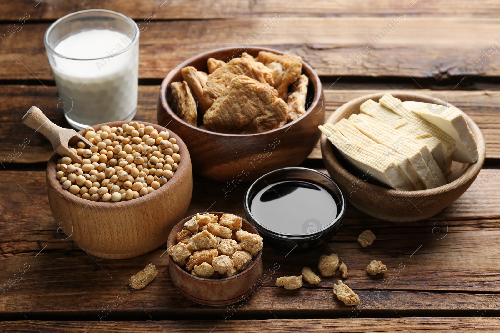 Photo of Different natural soy products on wooden table