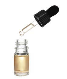 Bottle and pipette with essential oil on white background