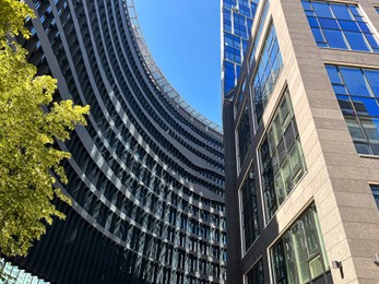 Photo of Low angle view of modern office buildings on sunny day
