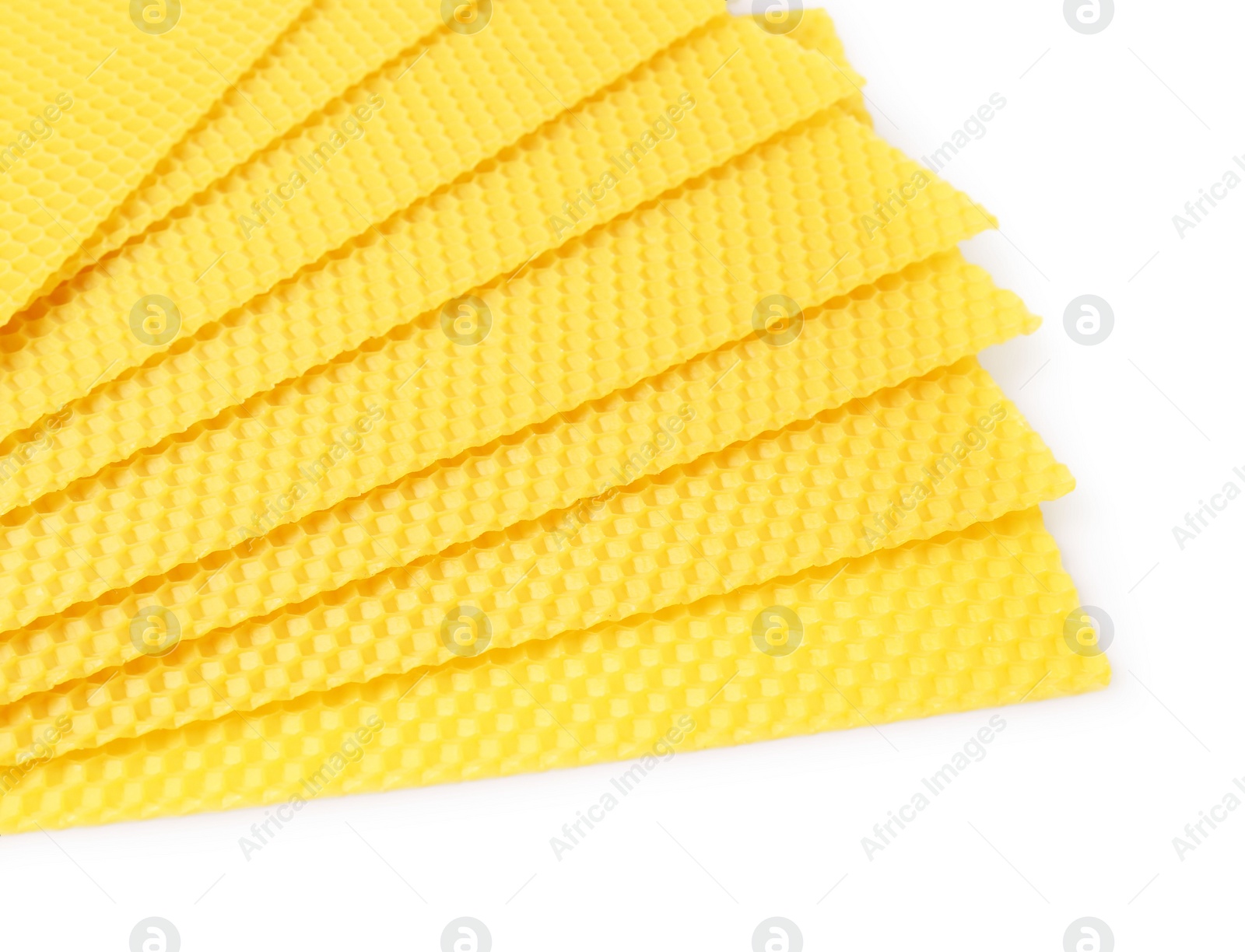 Photo of Natural organic beeswax sheets on white background