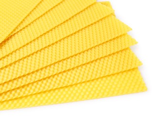 Natural organic beeswax sheets on white background