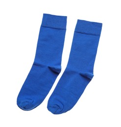 Photo of Blue socks on white background, top view