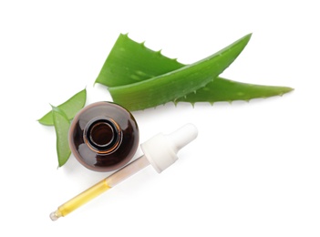 Bottle with aloe essential oil and fresh leaves on white background