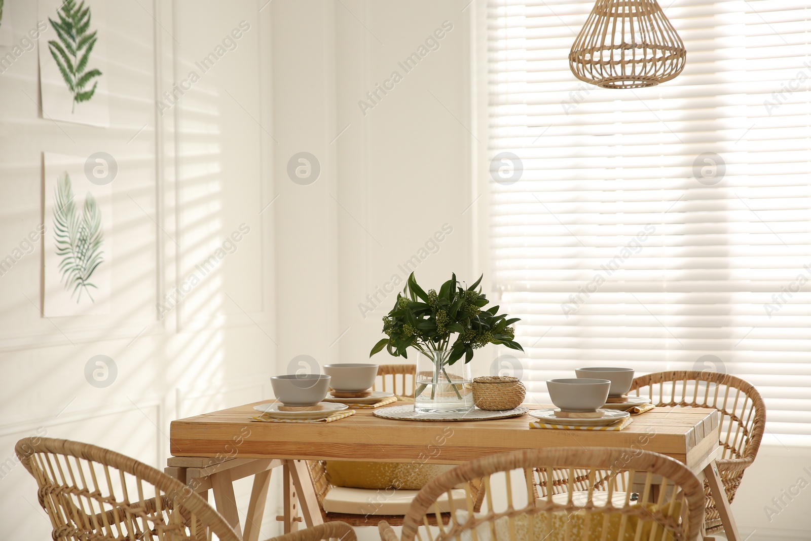 Photo of Stylish wooden dining table and chairs in room. Interior design