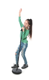 Photo of Little girl singing into microphone on white background