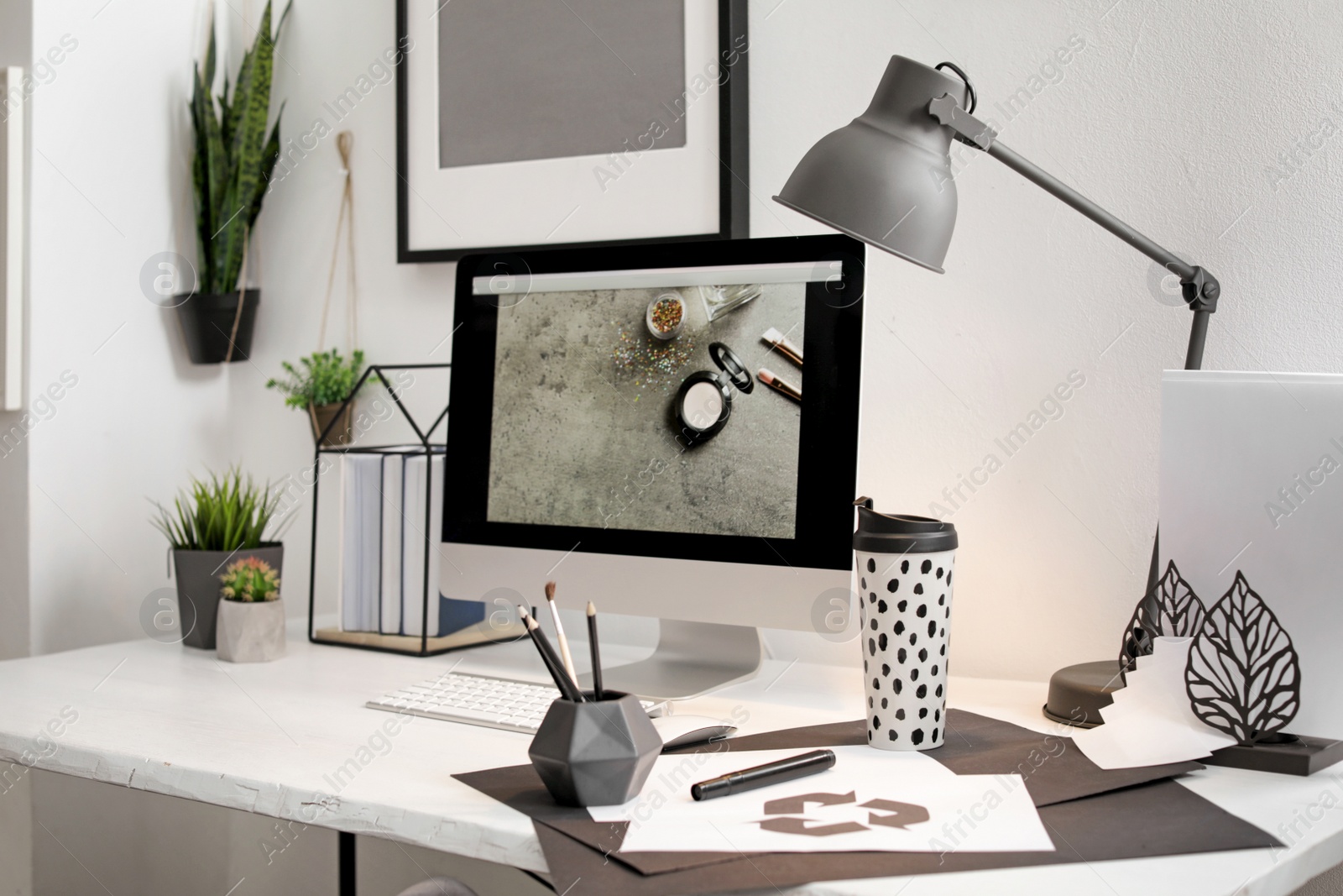 Photo of Stylish workplace with modern computer on desk