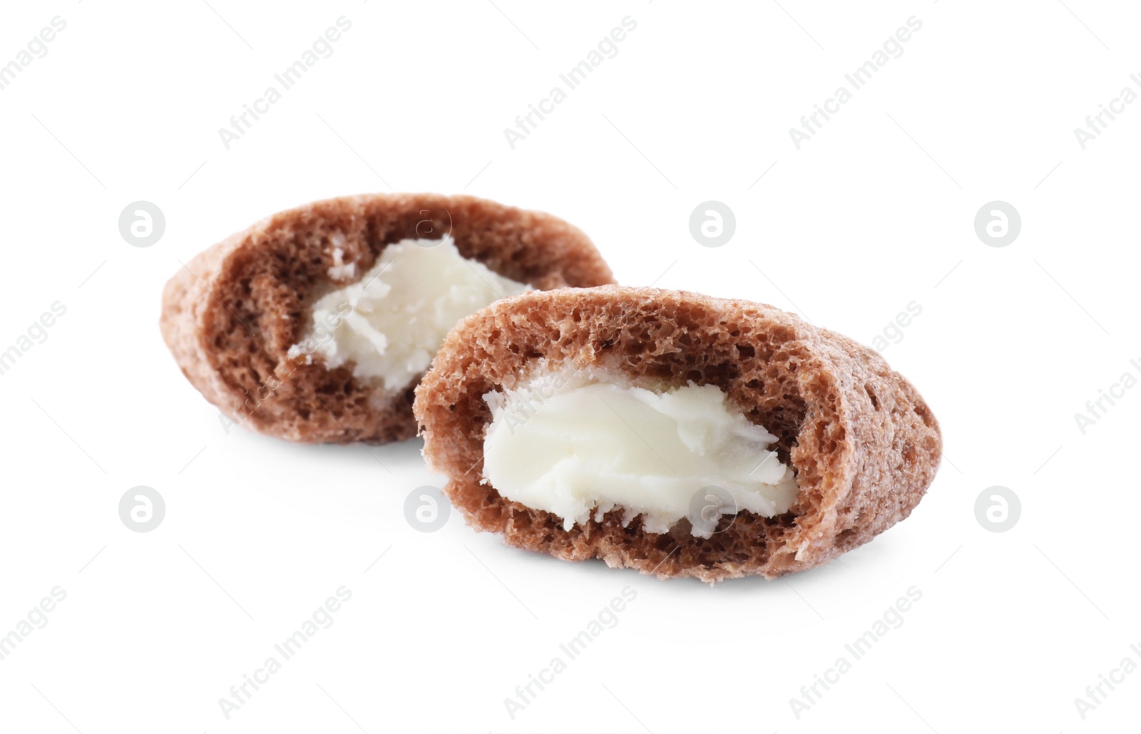 Photo of Broken chocolate corn pad with milk filling on white background