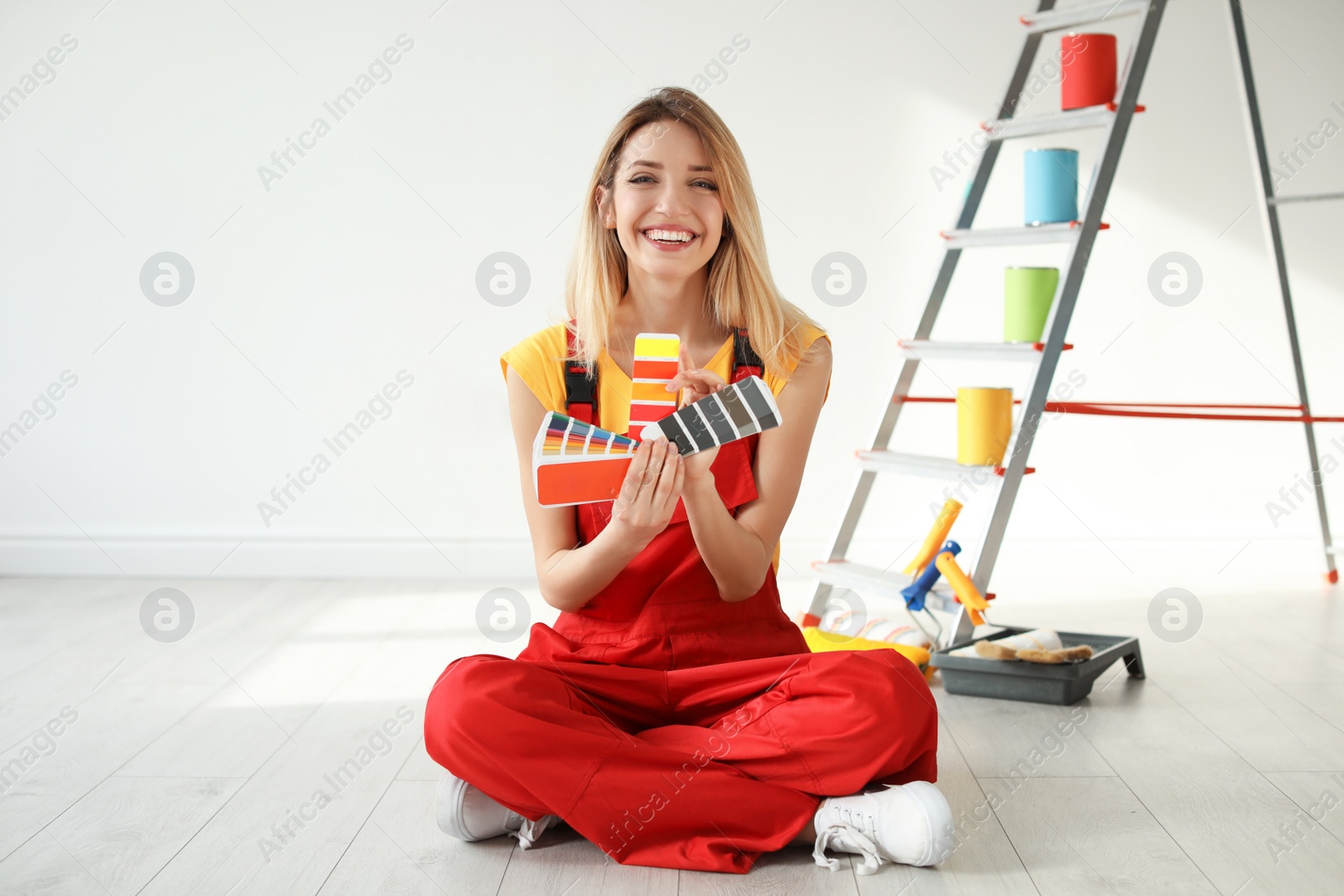 Photo of Female decorator with color palette indoors