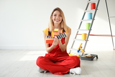 Female decorator with color palette indoors