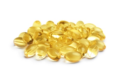 Photo of Cod liver oil pills on white background