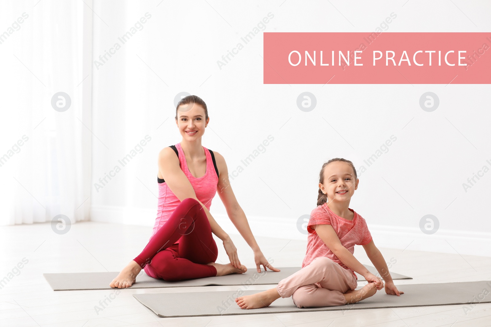 Image of Mother and daughter practicing yoga at home