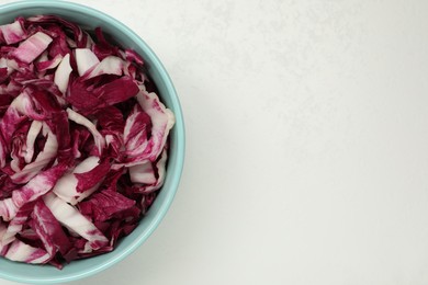 Photo of Cut radicchio on white background, top view. Space for text