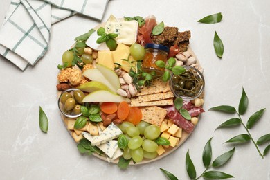 Photo of Different tasty appetizers on light table, flat lay