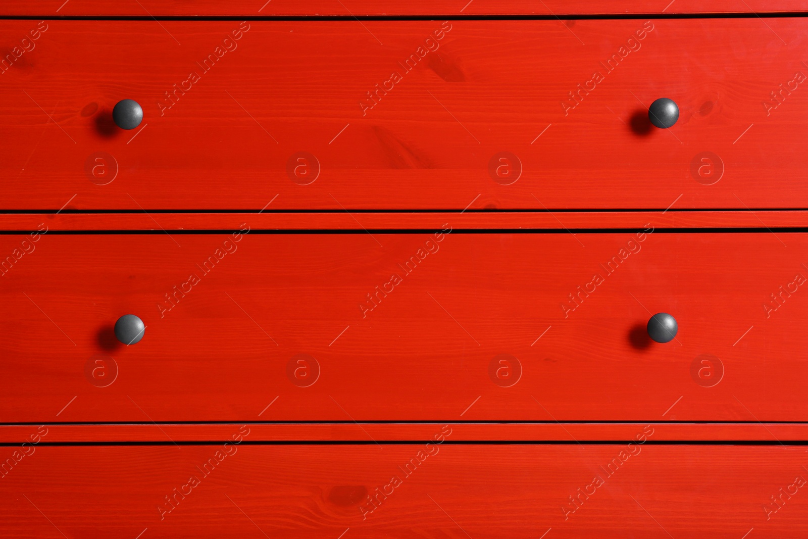 Photo of Red wardrobe drawers as background, closeup view