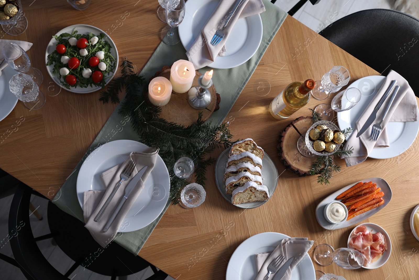 Photo of Christmas table setting with festive decor and dishware, top view