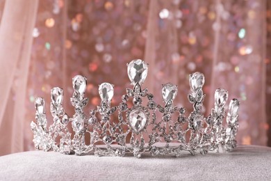 Photo of Beautiful silver tiara with diamonds on grey cloth