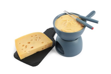 Fondue with tasty melted cheese, forks and piece isolated on white