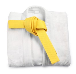 Photo of Yellow karate belt and kimono on white background, top view