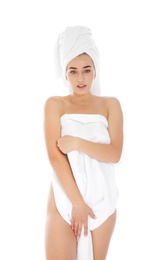 Portrait of young pretty woman with towels on white background