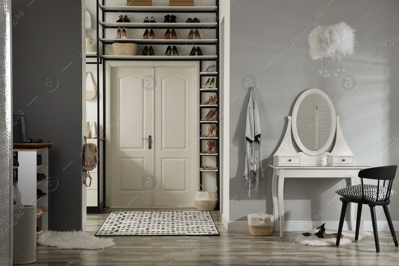 Photo of Dressing room interior with storage rack for shoes and accessories