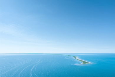 Image of Beautiful seascape with spit under blue sky