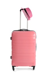 Photo of Suitcase with hat on white background. Travel preparation