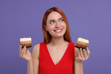 Photo of Young woman with pieces of tasty cake on purple background