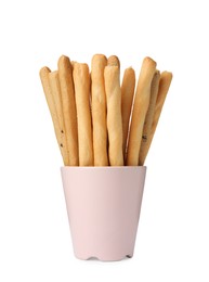 Delicious grissini sticks in cup on white background