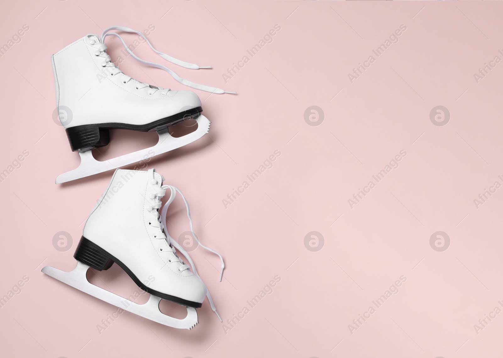 Photo of Pair of skates on color background, flat lay. Space for text