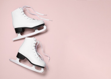 Photo of Pair of skates on color background, flat lay. Space for text