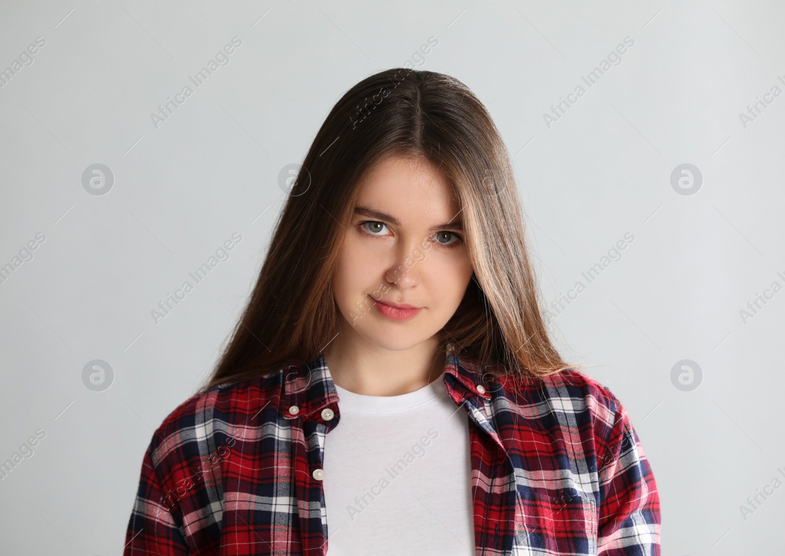 Photo of Portrait of young woman on light background