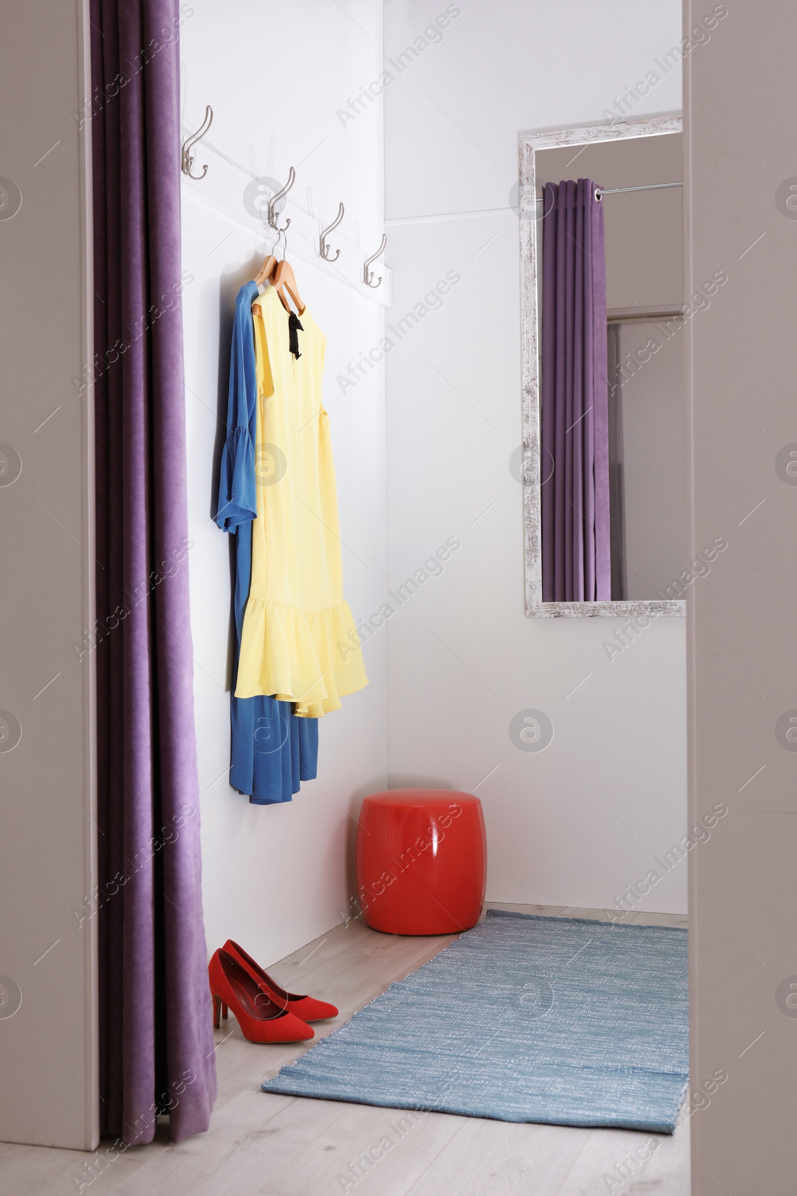 Photo of Empty dressing room in fashion store. Stylish interior