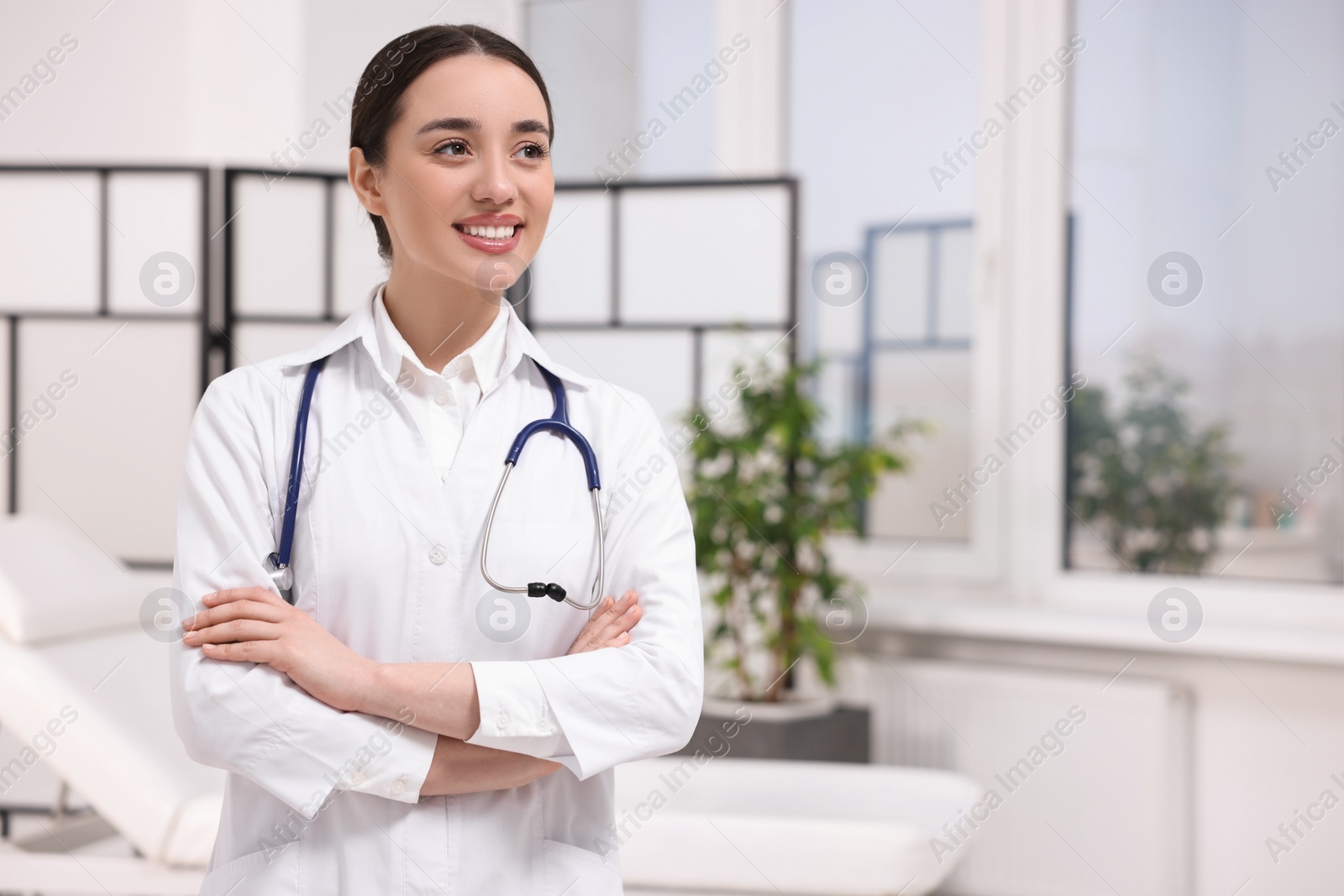 Photo of Medical consultant with stethoscope in clinic, space for text