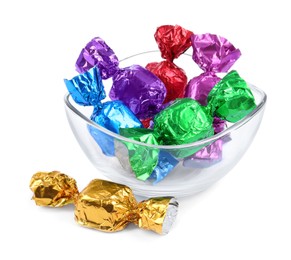 Photo of Bowl with many tasty candies in colorful wrappers isolated on white