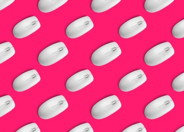 Image of Many white computer mouses on bright pink background, flat lay. Seamless pattern design