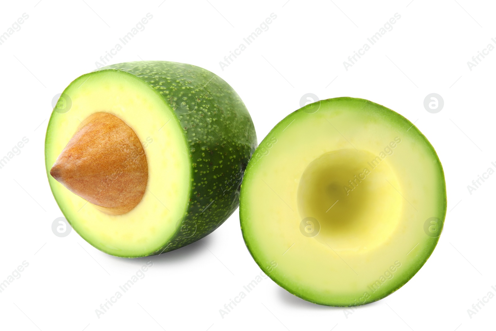 Photo of Cut tasty ripe avocado on white background. Tropical fruit