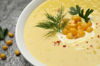 Photo of Delicious creamy corn soup in bowl, closeup