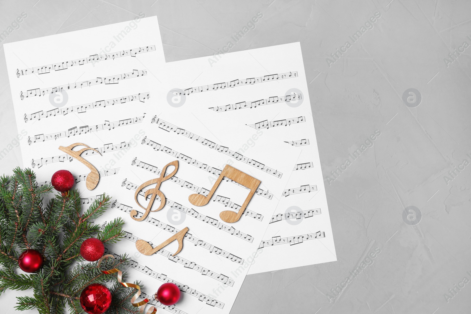 Photo of Composition with wooden music notes on grey background, top view