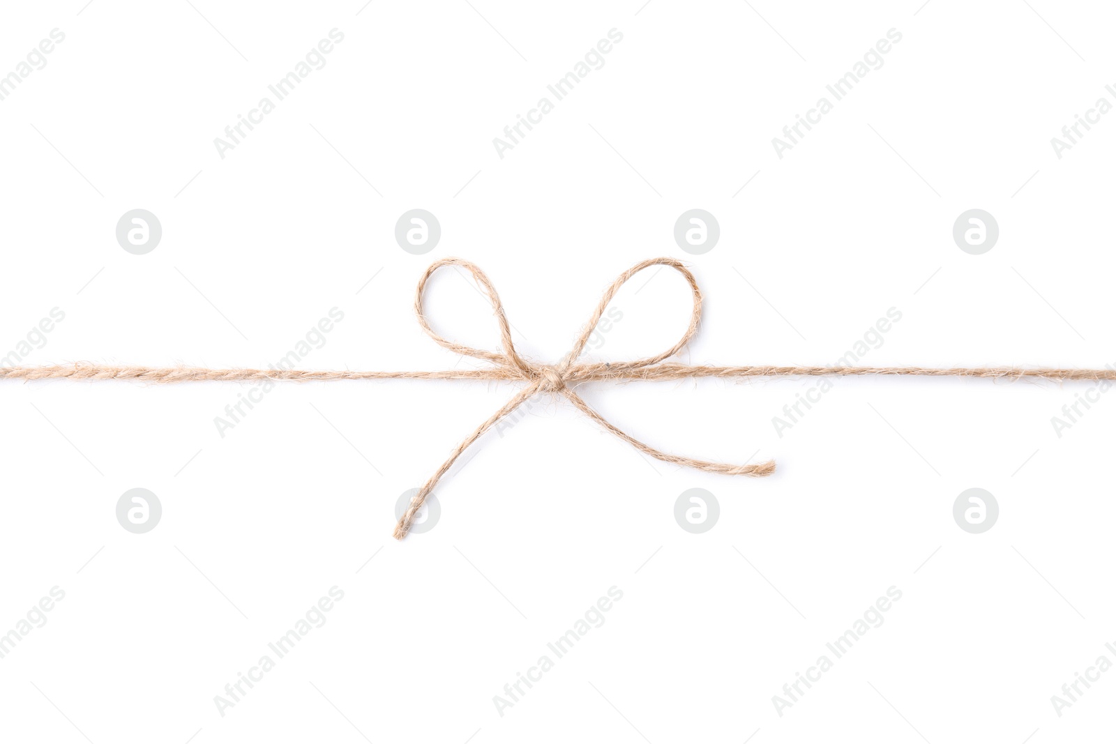 Photo of Linen rope string with bow isolated on white, top view