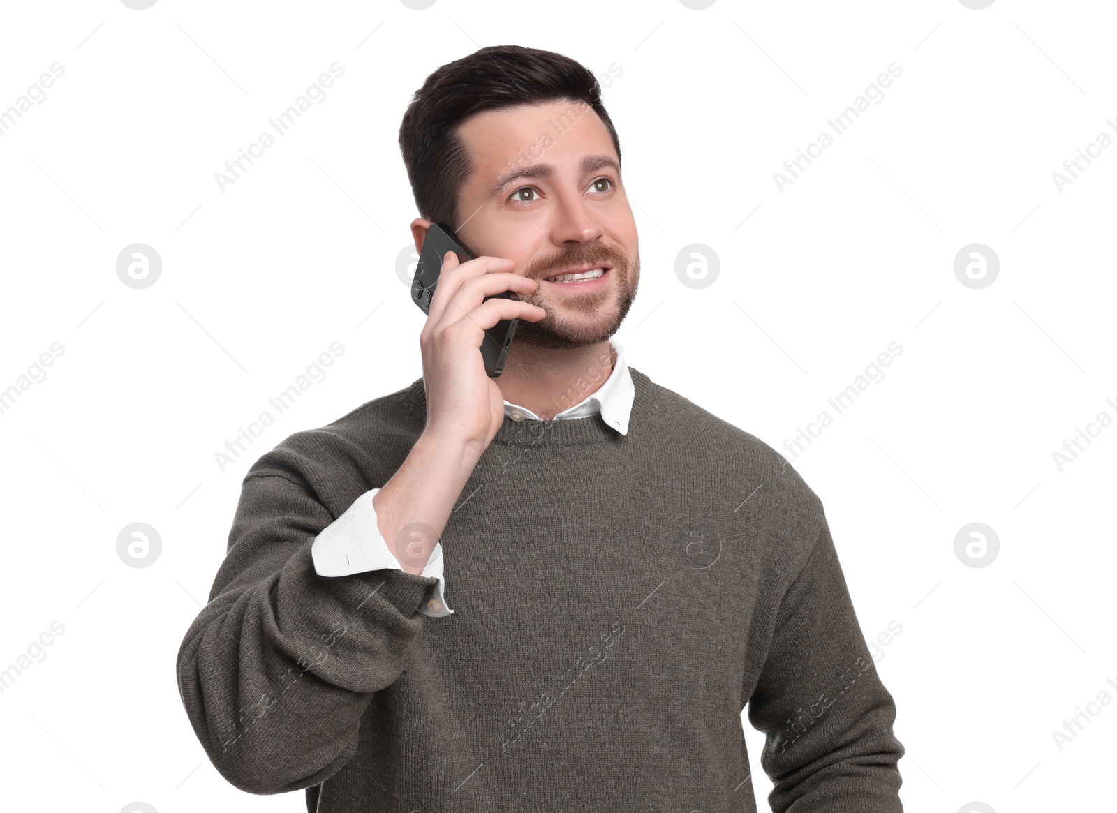 Photo of Handsome bearded businessman talking on smartphone against white background