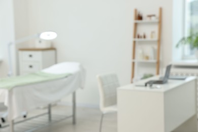 Modern interior of dermatologist's office with examination table